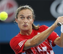 Dolgopolov beats injury, Simon to advance to Brisbane final