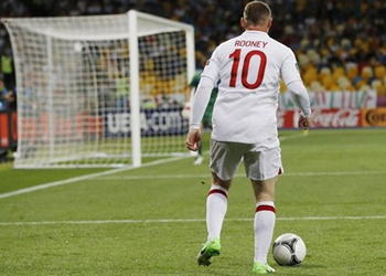 Rooney still needs to improve as a player, says England coach Gary Neville