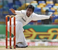 Ojha retains 5th place, Tendulkar moves a place down