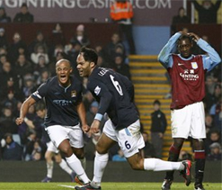 Lescott sends Man City back to the top