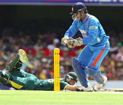 Dhoni banned for slow over rate