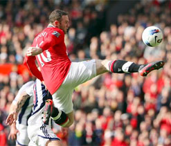 Rooney fires United to top as City crash at Swansea