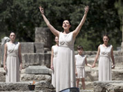 A priestess performs in front of the ancient temple of Hera during the final dress rehearsal for the lighting of the Olympic flame held in Ancient Olympia, Greece.