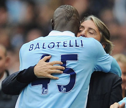 Mancini says Balotelli will definitely stay with Man City next season
