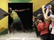 Usain Bolt models a Jamaica Olympic kit designed by Cedella Marley, daughter of Bob Marley, during the kit unveiling in London.