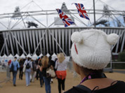 Performers arrive at the Olympic Stadium for opening ceremony rehearsals for the 2012 Summer Olympics in London.