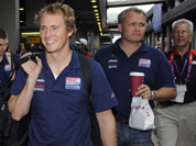 Members of the U.S. Olympic sailing team are escorted following their arrival at Heathrow Airport in London.