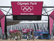 British military personnel enter into the Olympic Park before the start of the 2012 Summer Olympics in London.