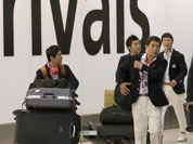 Members of the South Korean Men Gymnastics team arrive at Heathrow Airport in London.