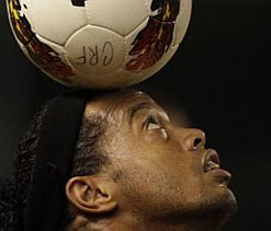Ronaldinho dazzles despite abuse from opposing fans