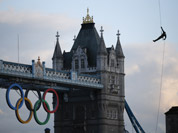 Royal Marine Martyn Williams, rappels down from a Royal Navy Sea King helicopter into the Tower of London with the Olympic torch.