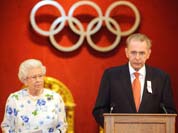 Britain`s Queen Elizabeth II listens as the President of the International Olympic Committee Jacques Rogge speaks at Buckingham Palace, in London.