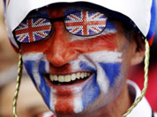 Michael Burn of Watford England smiles outside the Olympic Park at the Westfield mall ahead of the 2012 Summer Olympics Opening Ceremony in London.