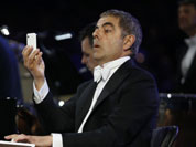 Actor Rowan Atkinson performs during the Opening Ceremony at the 2012 Summer Olympics in London.