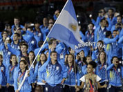 Argentina`s Luciana Aymar carries her national flag during the Opening Ceremony at the 2012 Summer Olympics in London.