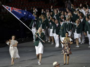 Australia`s Lauren Jackson carries her country`s national flag during the Opening Ceremony at the 2012 Summer Olympics in London.