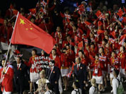 China`s Jianlian Yi carries the flag during the Opening Ceremony at the 2012 Summer Olympics in London.