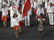 Poland`s Agnieszka Radwanska carries the flag during the Opening Ceremony at the 2012 Summer Olympics in London.