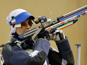 Iran`s Elaheh Ahmadi shoots during the women`s 10-meter air rifle final at the 2012 Summer Olympics.
