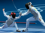 Hyun Hee Nam of South Korea, left, and Olga Leleyko of Ukraine compete in the round of 32 during women`s fencing at the 2012 Summer Olympics.
