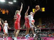 Canada`s Teresa Gabriele (5) shoots over Russia`s Kim Smith (8) and Natalie Achonwa (11) during the second half of a preliminary women`s basketball game at the 2012 Summer Olympics.