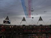 The Red Arrows flies over the stadium during the Opening Ceremony at the 2012 Summer Olympics in London.