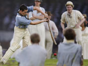 Performers play a game of cricket during the Opening Ceremony at the 2012 Summer Olympics in London.