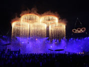 The Olympic rings are lit with pyrotechnics during the Opening Ceremony at the 2012 Summer Olympics in London.