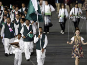 Pakistan`s Sohail Abbas carries the flag during the Opening Ceremony at the 2012 Summer Olympics in London.
