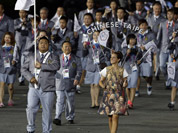 Taiwan`s Chen Shih-chieh carries the national flag during the Opening Ceremony at the 2012 Summer Olympics in London.