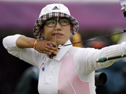 South Korea`s Lee Sung-jin aims for the target during an individual ranking round at the 2012 Summer Olympics in London. 