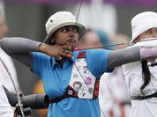 Deepika Kumari shoots next to Mexico`s Aida Roman during an individual ranking round at the 2012 Summer Olympics in London.