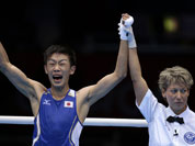Japan`s Satoshi Shimizu reacts after defeating Ghana`s Isaac Dogboe in a bantam weight 56-kg preliminary boxing match at the 2012 Summer Olympics in London.