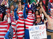 US supporters cheer during the group G women`s soccer match between the United States and Colombia at the London 2012 Summer Olympics  at Hampden Park Stadium in Glasgow, Scotland.
