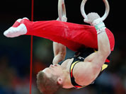 German gymnast Fabian Hambuchen performs on the rings during the Artistic Gymnastics men`s qualification at the 2012 Summer Olympics, Saturday, July 28, 2012, in London.