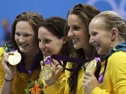 From left, Australia`s Alicia Coutts, Cate Campbell, Brittany Elmslie and Melanie Schlanger pose with their gold medals for the women`s 4x100-meter freestyle relay swimming final at the Aquatics Centre in the Olympic Park during the 2012 Summer Olympics in London.