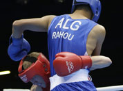Australia`s Jess Ross fights Algeria`s Abelmalek Rahou, right, during a middle weight 75-kg preliminary boxing match at the 2012 Summer Olympics in London.