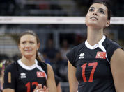 Turkey`s Neslihan Darnel, right, reacts near teammate Neriman Ozsoy, left, after hitting the ball into the net on a serve during a women`s preliminary volleyball match against Brazil at the 2012 Summer Olympics in London. 
