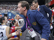 Russian Prime Minister Dmitry Medvedev, right, congratulates a member of the Russian volleyball team Yekaterina Gamova after a women`s preliminary volleyball match between Britain and Russia at the 2012 Summer Olympics, in London.
