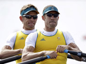 Australia`s Scott Brennan, and David Crawshay stroke during a men`s rowing double sculls repechage in Eton Dorney, near Windsor, England, at the 2012 Summer Olympics.