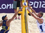 Pablo Allepuz Herrera, left, from Spain fights for a ball with Premysl Kubala, right, from Czech Republic during their Beach Volleyball match at the 2012 Summer Olympics in London.