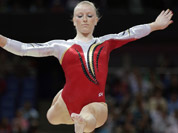 Gymnast Gaelle Mys from Belgium performs on the balance beam during the Artistic Gymnastics women`s qualification at the 2012 Summer Olympics in London. 