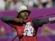 Deepika Kumari shoots during the women`s archery team competition at the 2012 Summer Olympics in London.