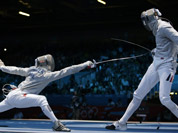 Germany`s Nicolas Limbach, right, and Poland`s Adam Skrodzki compete during the men`s individual sabre round of 32 fencing at the 2012 Summer Olympics in London. 