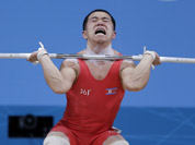 North Korea`s Yun Choi Om lifts during the men`s 56-kg, group B, weightlifting competition at the 2012 Summer Olympics in London.
