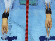 Britain`s Liam Tancock, left, and France`s Camille Lacourt start in a men`s 100-meter backstroke swimming heat at the Aquatics Centre in the Olympic Park during the 2012 Summer Olympics in London.