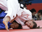 Luxembourg`s Marie Muller, right, competes with Mauritius`s Christianne Legentil during the women`s 52-kg judo competition at the 2012 Summer Olympics in London.