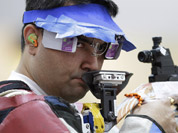 Gagan Narang shoots during qualifiers for the men`s 10-meter air rifle event at the 2012 Summer Olympics in London.