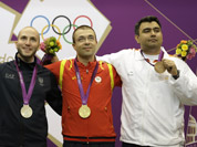 Gold medalist Alin George Moldoveanu of Romania poses with silver medalist Italy`s Niccolo Campriani and bronze medalist India`s Gagan Narang, during the victory ceremony for the men`s 10-meter air rifle at the 2012 Summer Olympics in London.