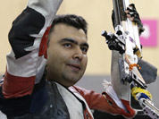 Gagan Narang celebrates winning the bronze medal at the end of the men`s 10-meter air rifle at the 2012 Summer Olympics in London. 